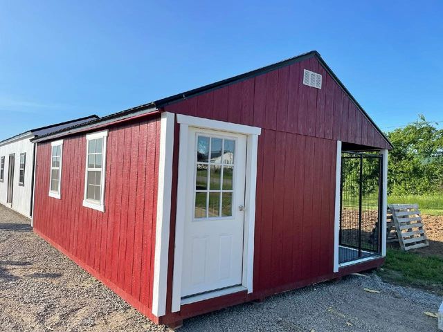 Barn red utility shed with built-in dog kennel